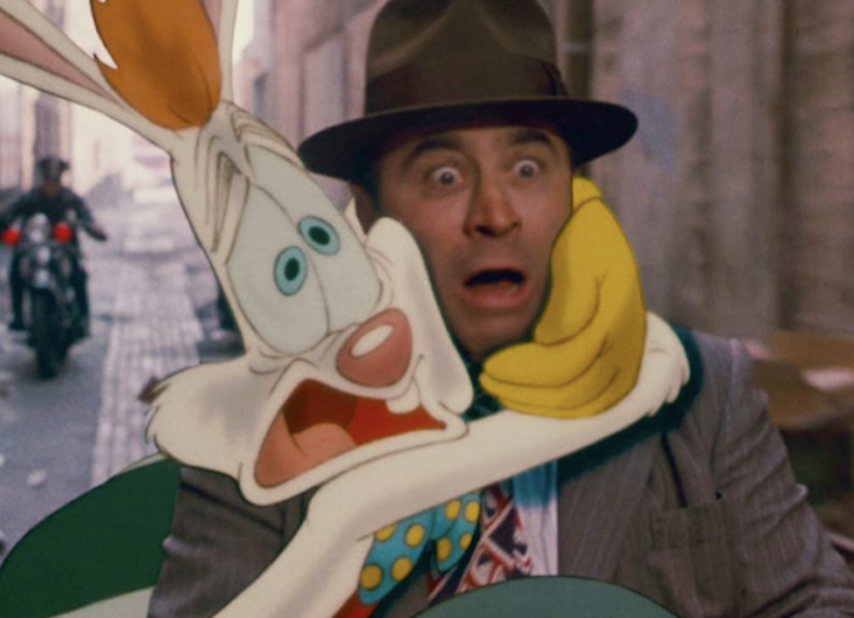 Roger Rabbit hugging a man around the neck and looking scared