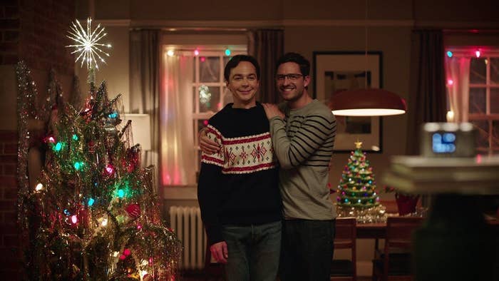 Michael (Jim Parons) and Kit (Ben Aldridge) in front of a Christmas tree in "Spoiler Alert"