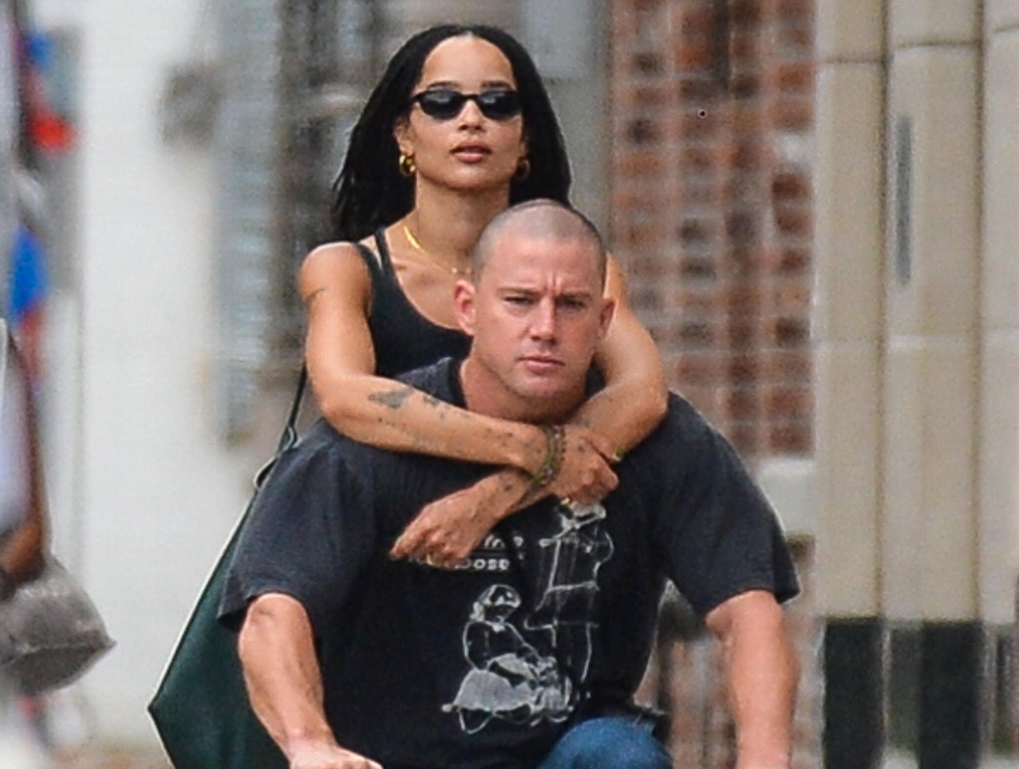 A closeup of Channing and Zoe on the bike