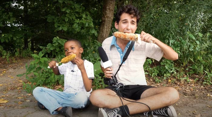 Tariq, Corn Kid, and Julian Shapiro-Barnum, creator of Recess Therapy, munching on corn together and having a corntastic day