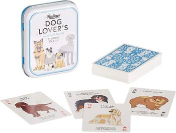 the dog tin and deck with examples of an irish setter, bernese mountain dog, afghan wolfhound, and chowchow cards