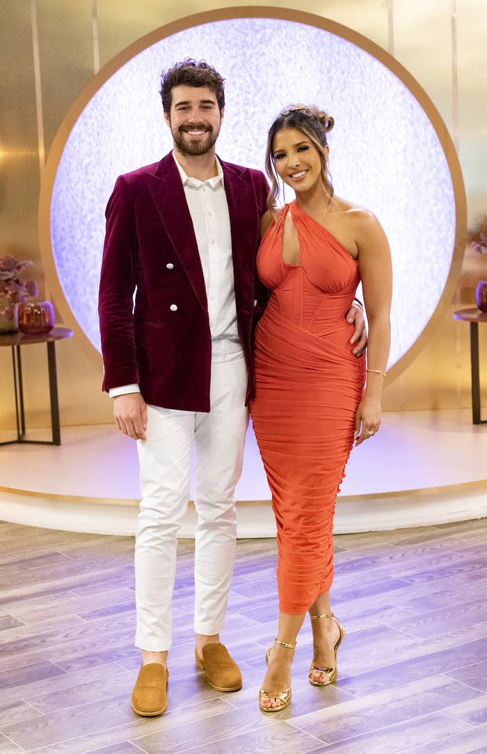 Zanab and Cole with their arms around each other as the pose for a photo at the reunion
