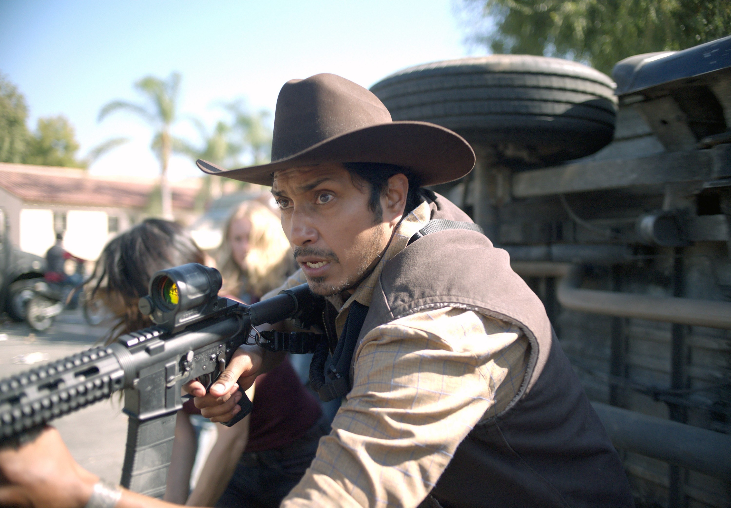 Tenoch Huerta in The Forever Purge holding a weapon