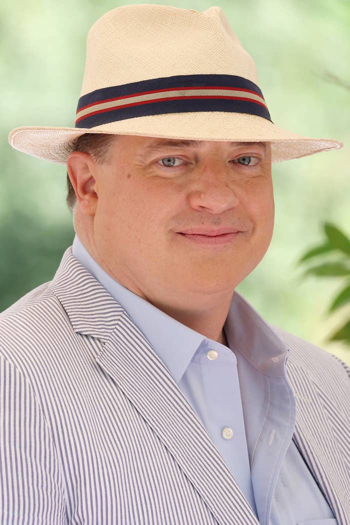 A closeup of Brendan Fraser wearing a fedora