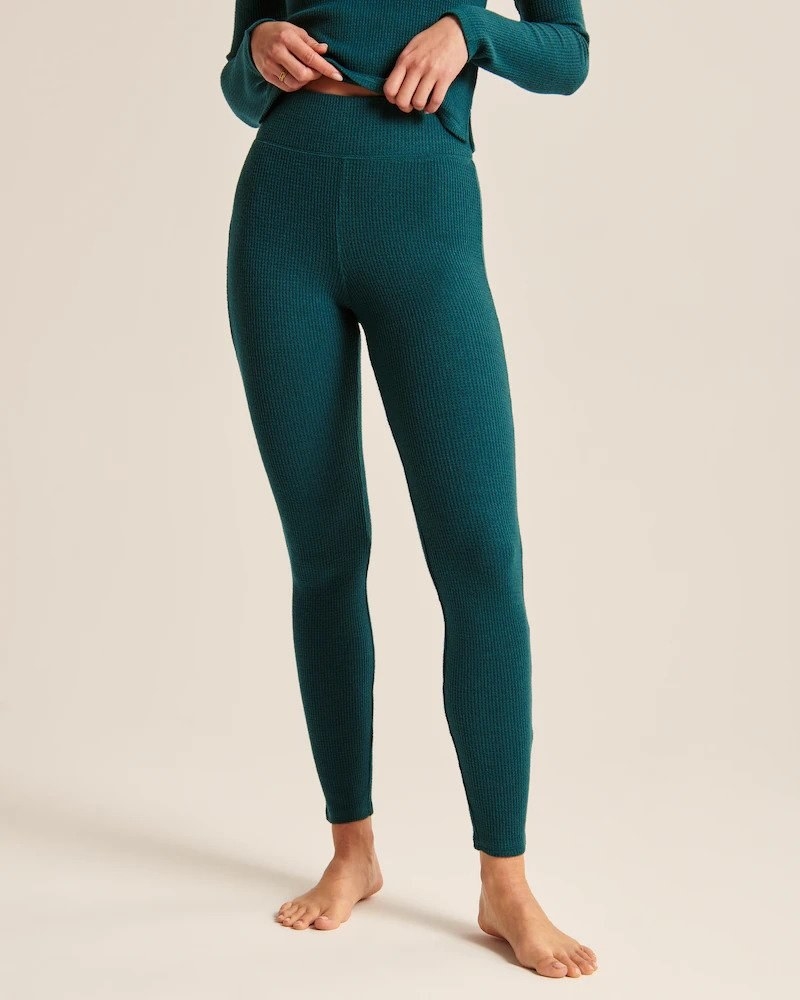 Model wearing dark green waffle leggings