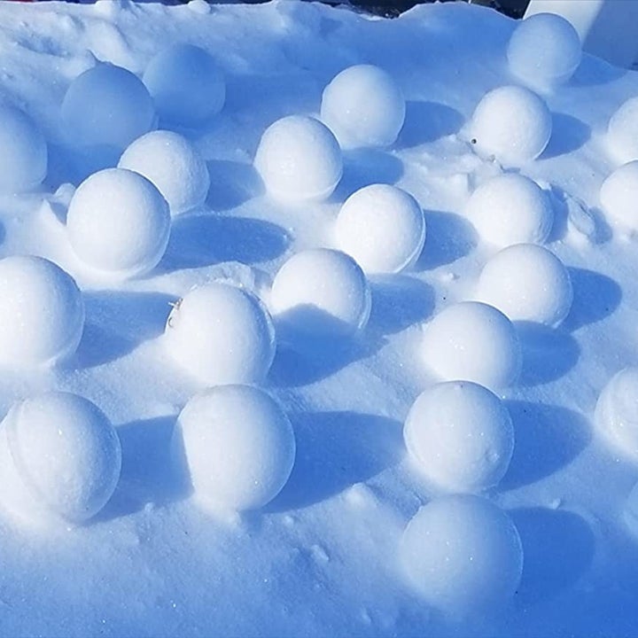Reviewer image of multiple snowballs made with snowball maker