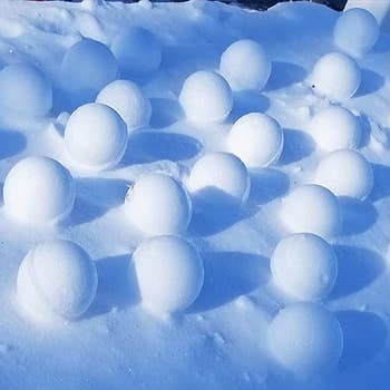 Reviewer image of multiple snowballs made with snowball maker