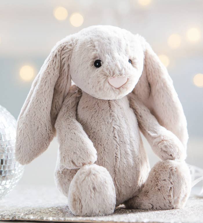 A stuffed bunny beside a disco ball
