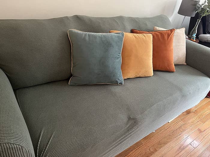 Reviewer photo of pillows on a sofa