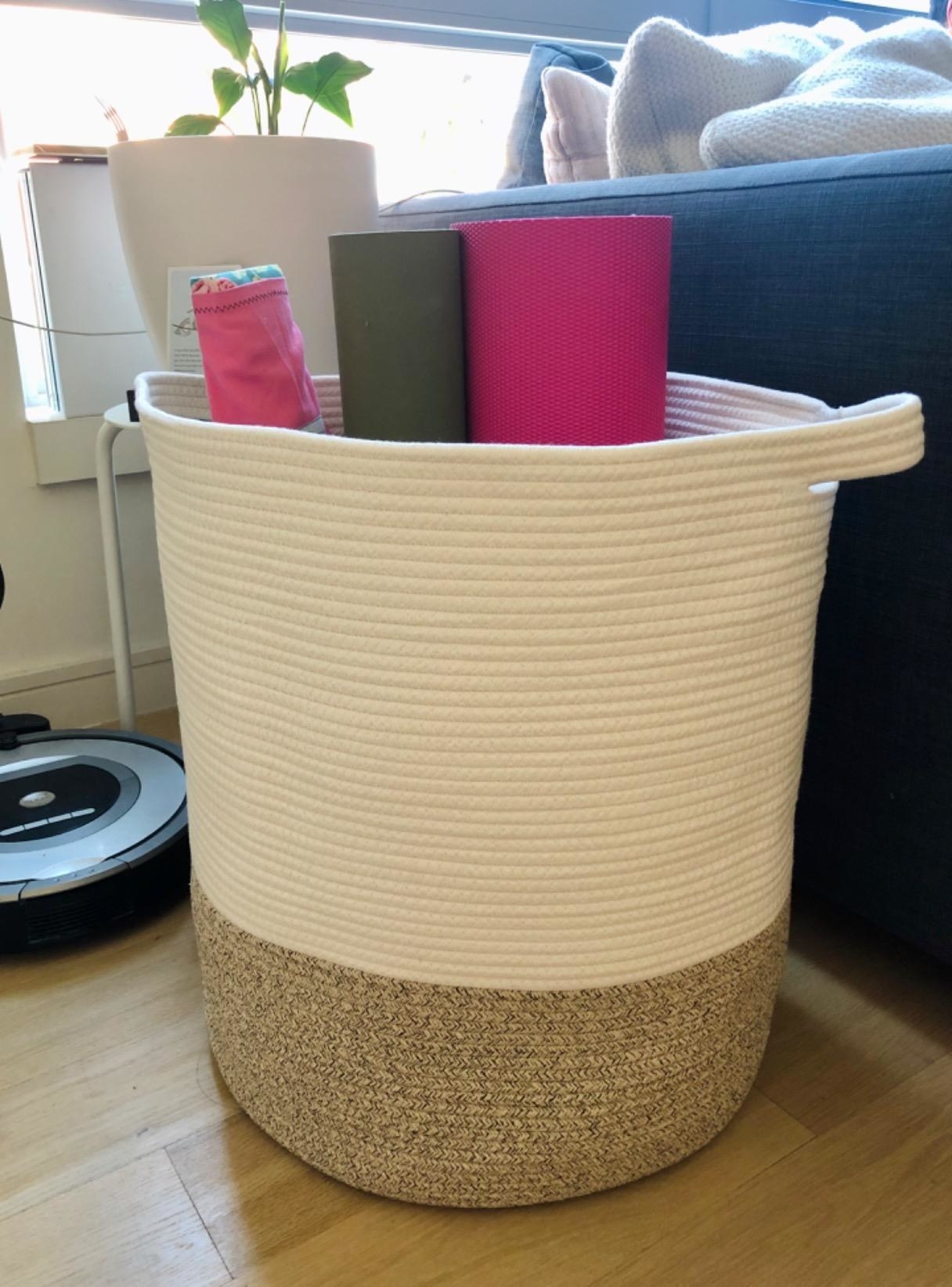 Reviewer photo of basket with yoga mats inside