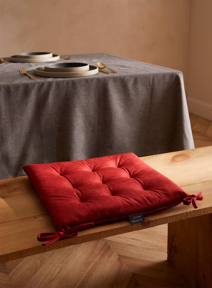 the cushion on a bench at a table