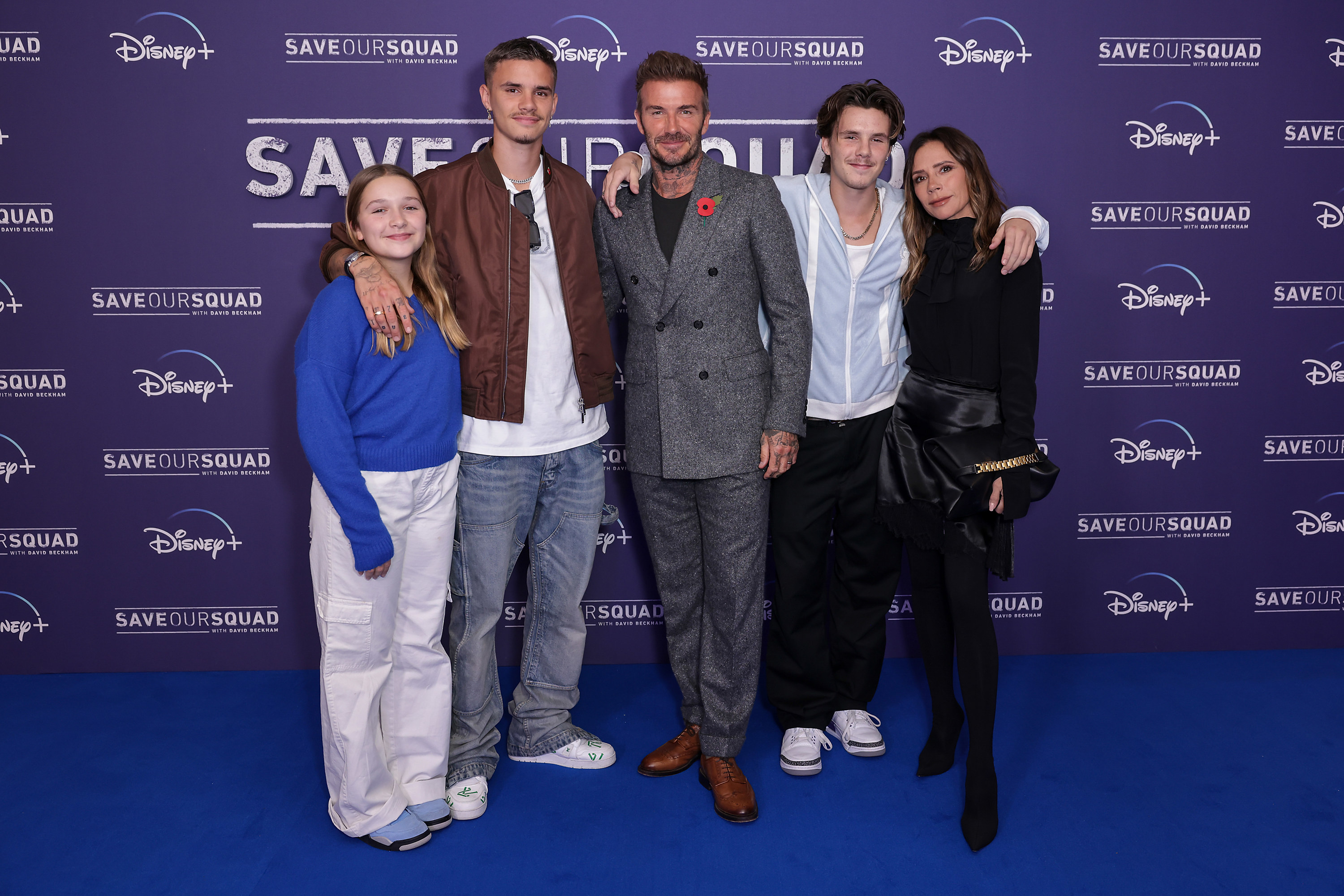 David and Victoria with three of their kids on the red carpet