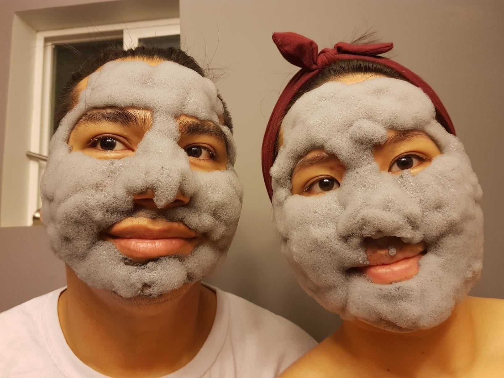 two reviewers wearing the grey mask which looks poofy and bubbly