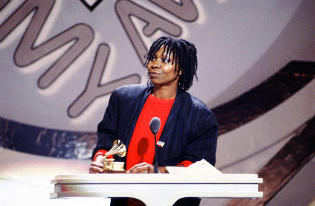 Whoopi accepting her award on stage