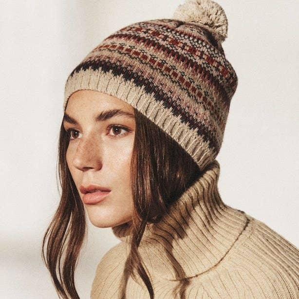 someone wearing the hat with a turtleneck sweater