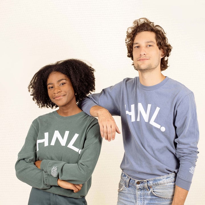 two models wearing green and blue crewnecks that read "HNL."