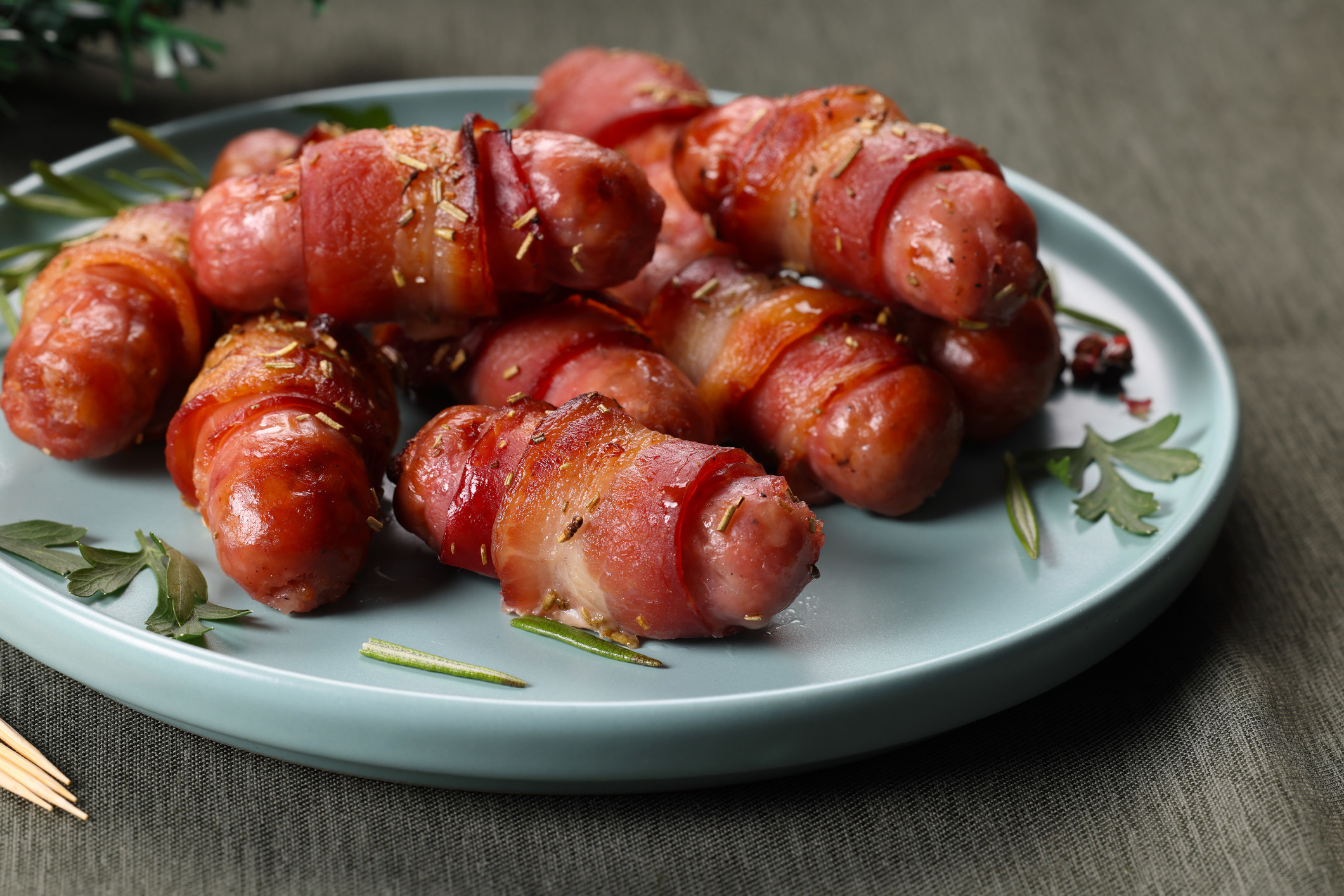 Bacon wrapped dates on a plate