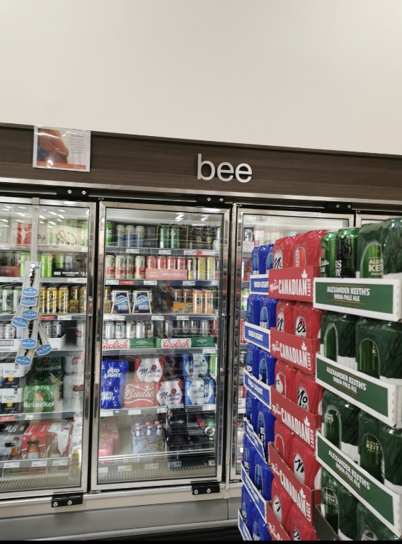 Beer aisle sign reading bee