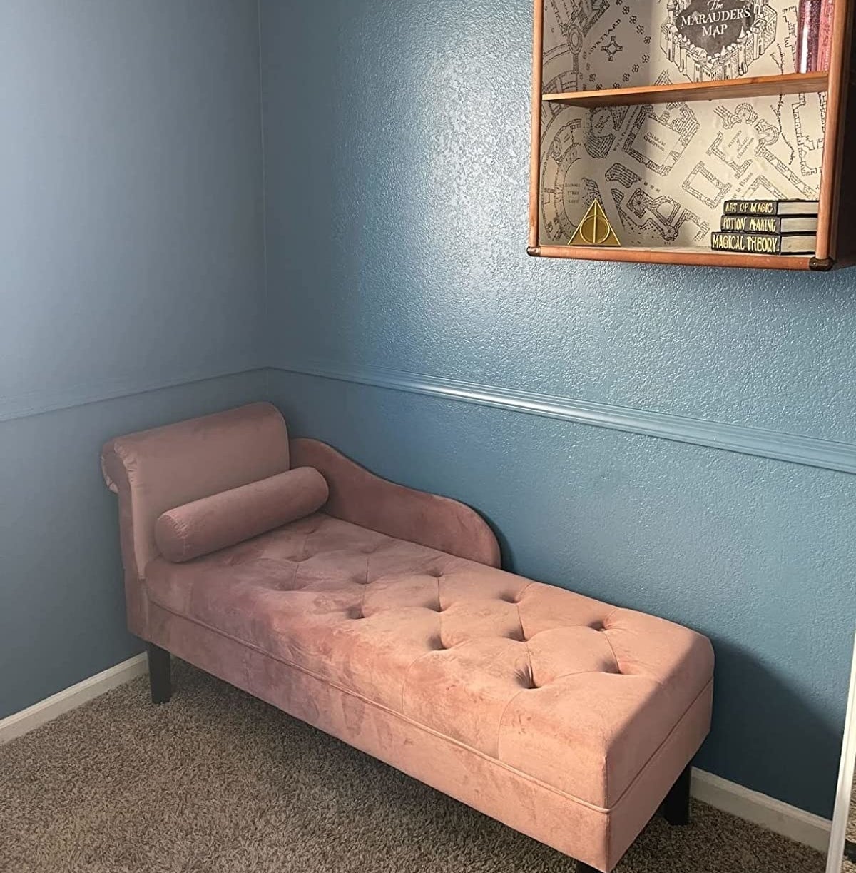 reviewer&#x27;s pink chaise lounge in their Harry Potter-themed office