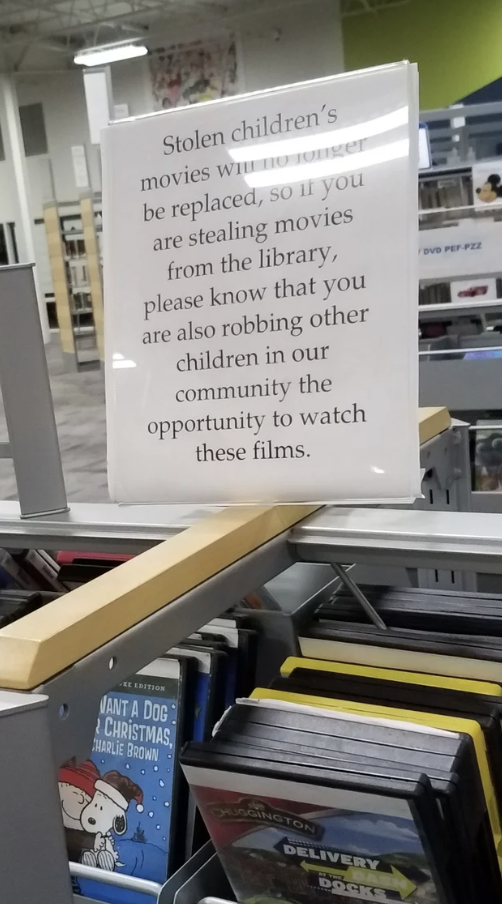 A note dissuading people from stealing movies from the library