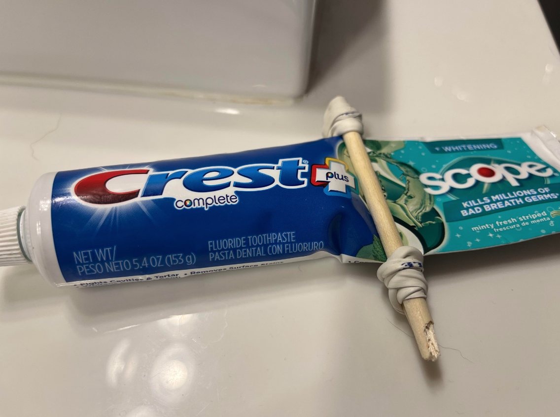 toothpick tied to some toothpaste