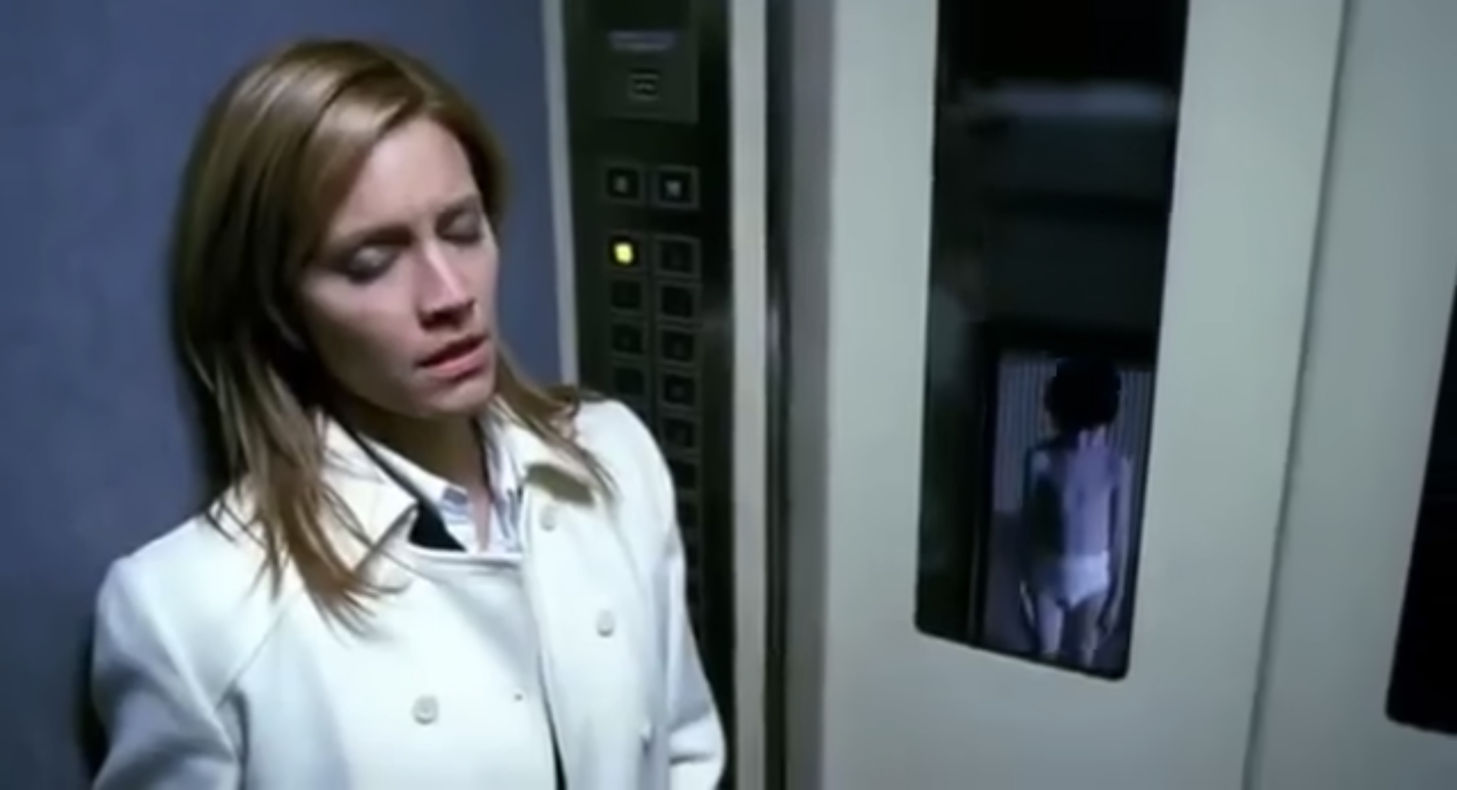 woman in elevator with eyes closed