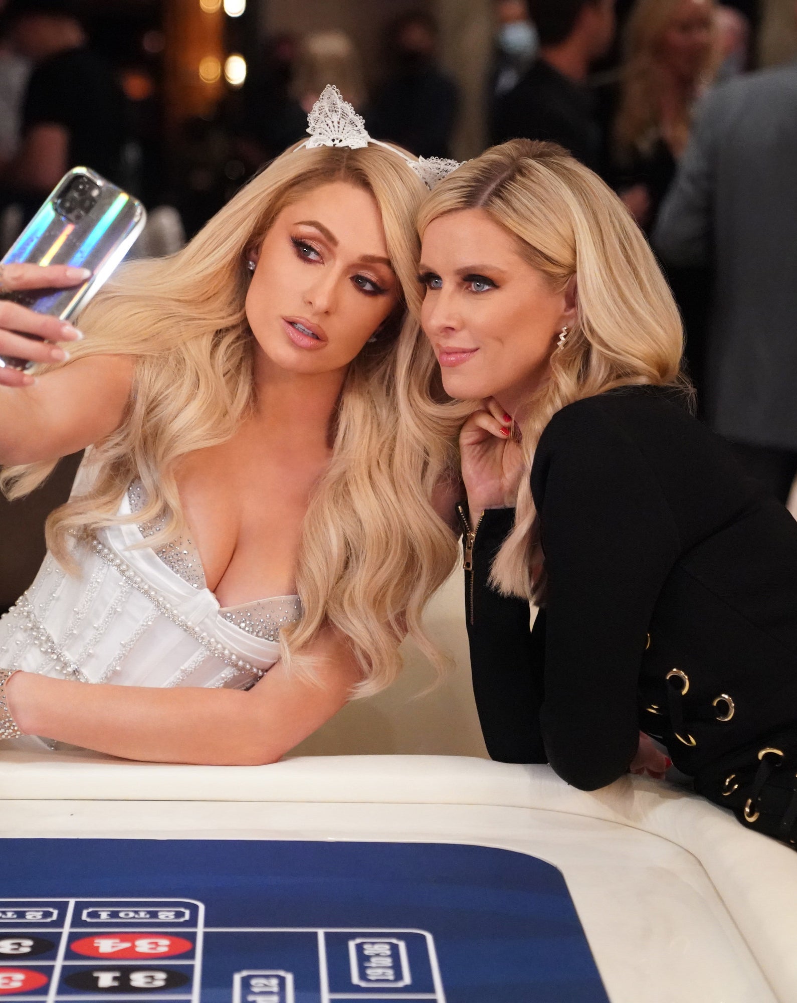paris hilton taking a selfie with her sister at her vegas wedding