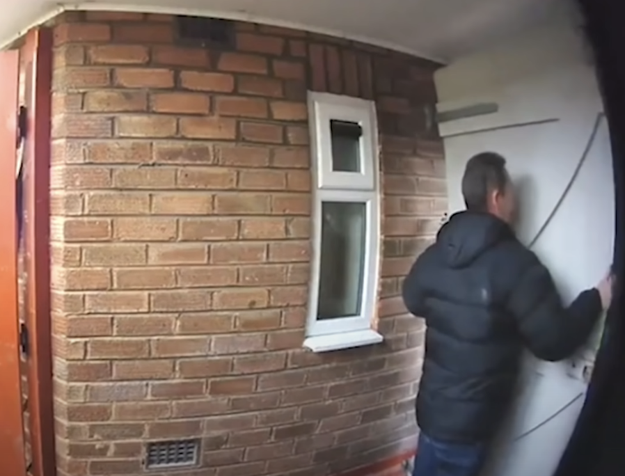man next to a door outside via a ring doorbell camera