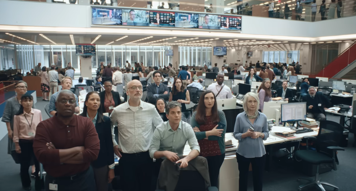 The newsroom collectively looking at something