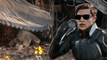 gif of cyclops taking off his glasses and showing laser beams