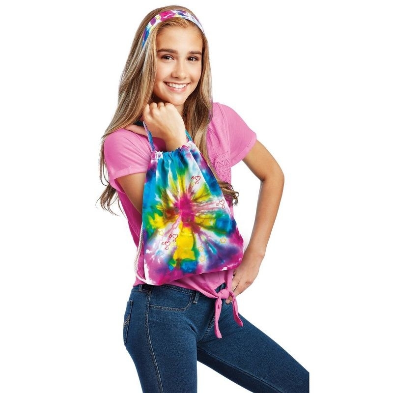 person with tie dye materials