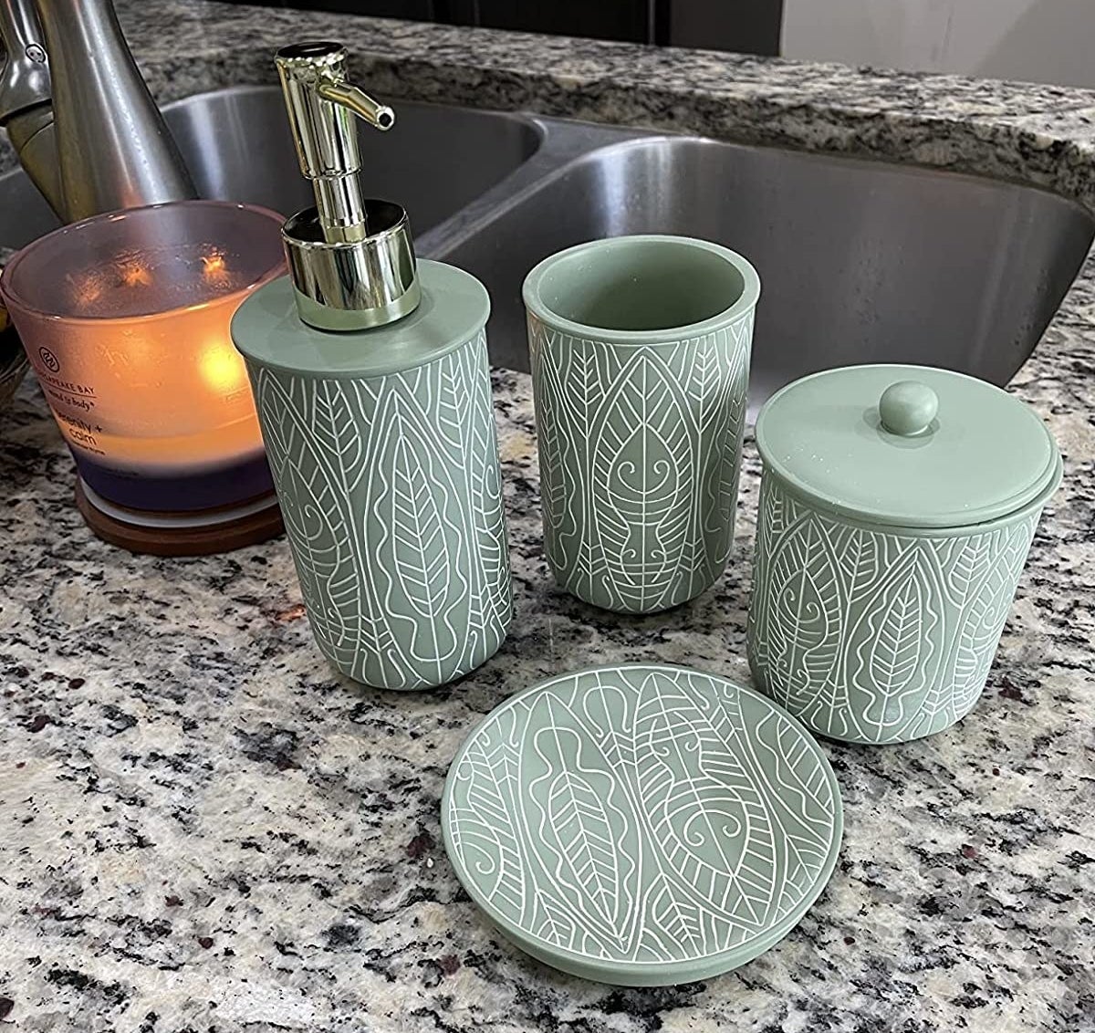 a reviewer photo of the green and white set on a countertop