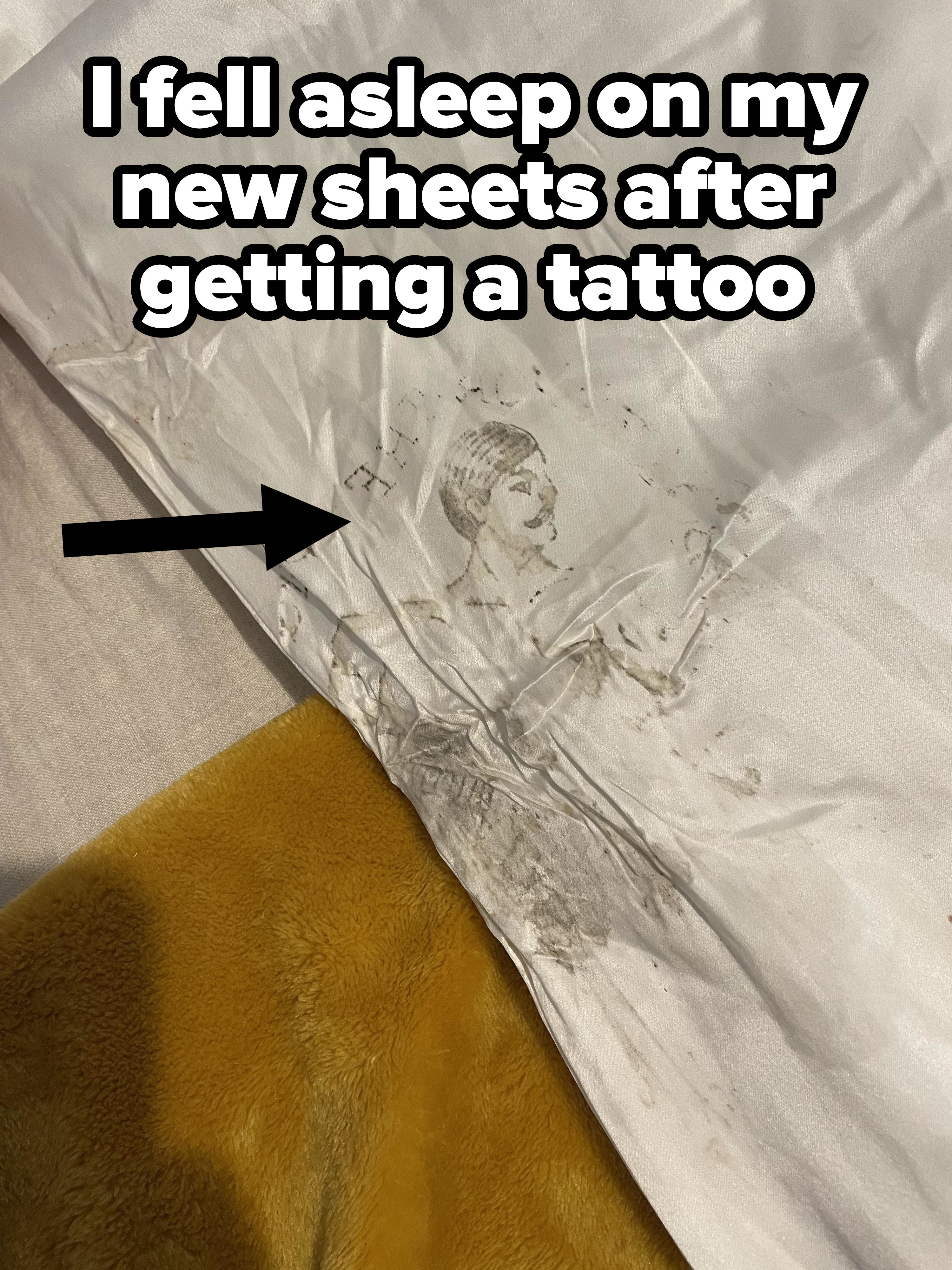 person who stained their sheets with a new tattoo
