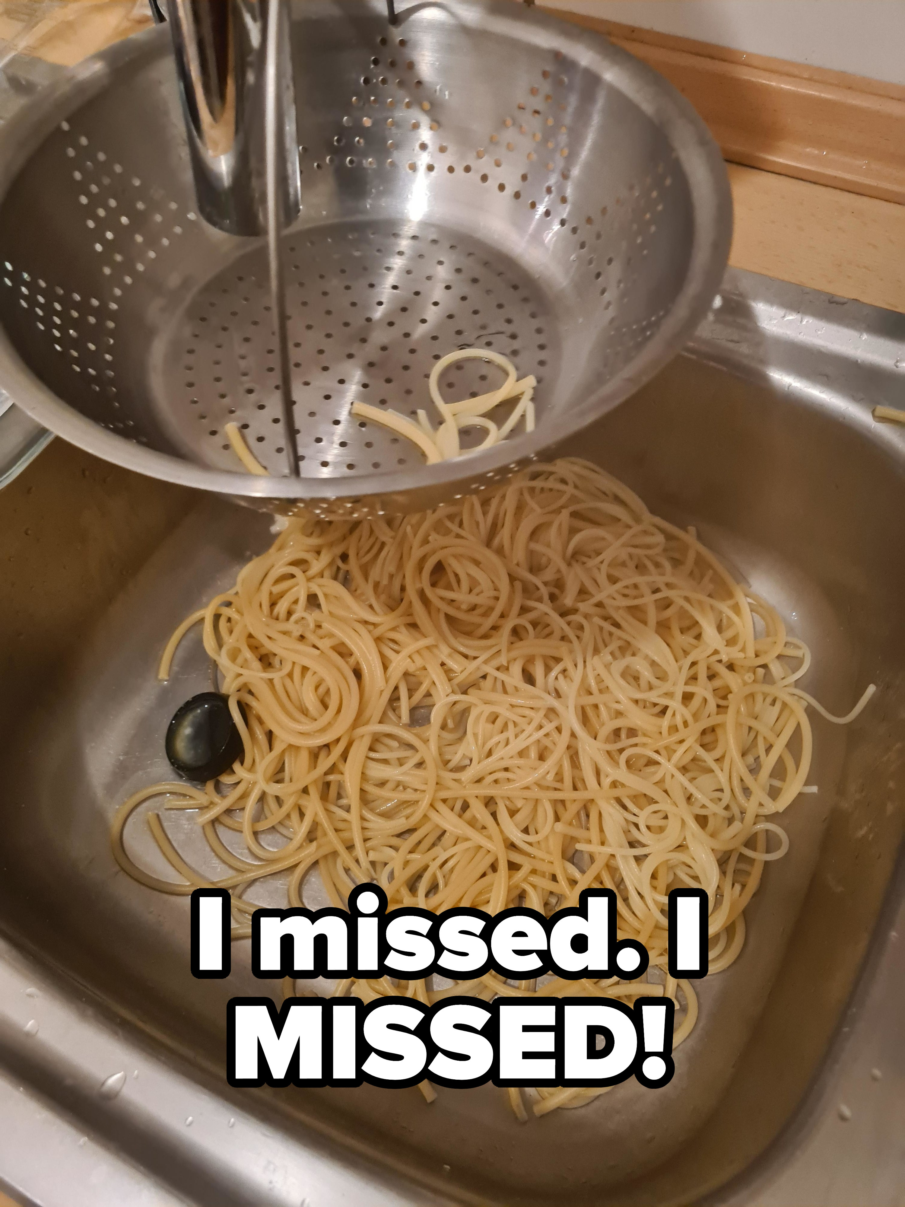 person who missed the collandar with spaghetti