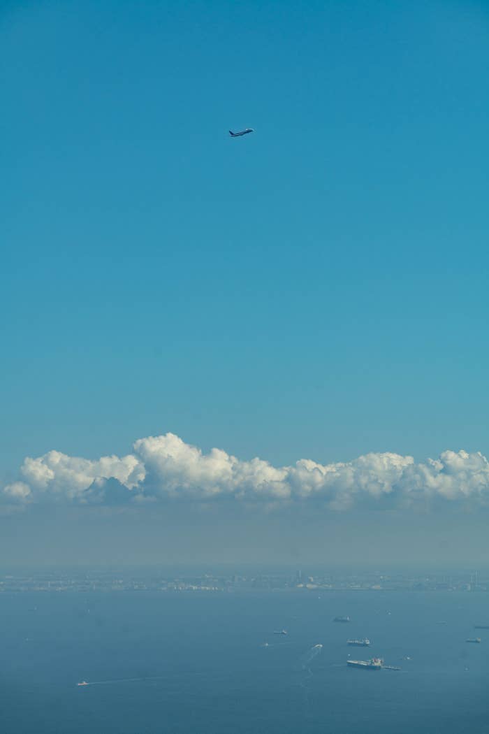 plane flying over sea