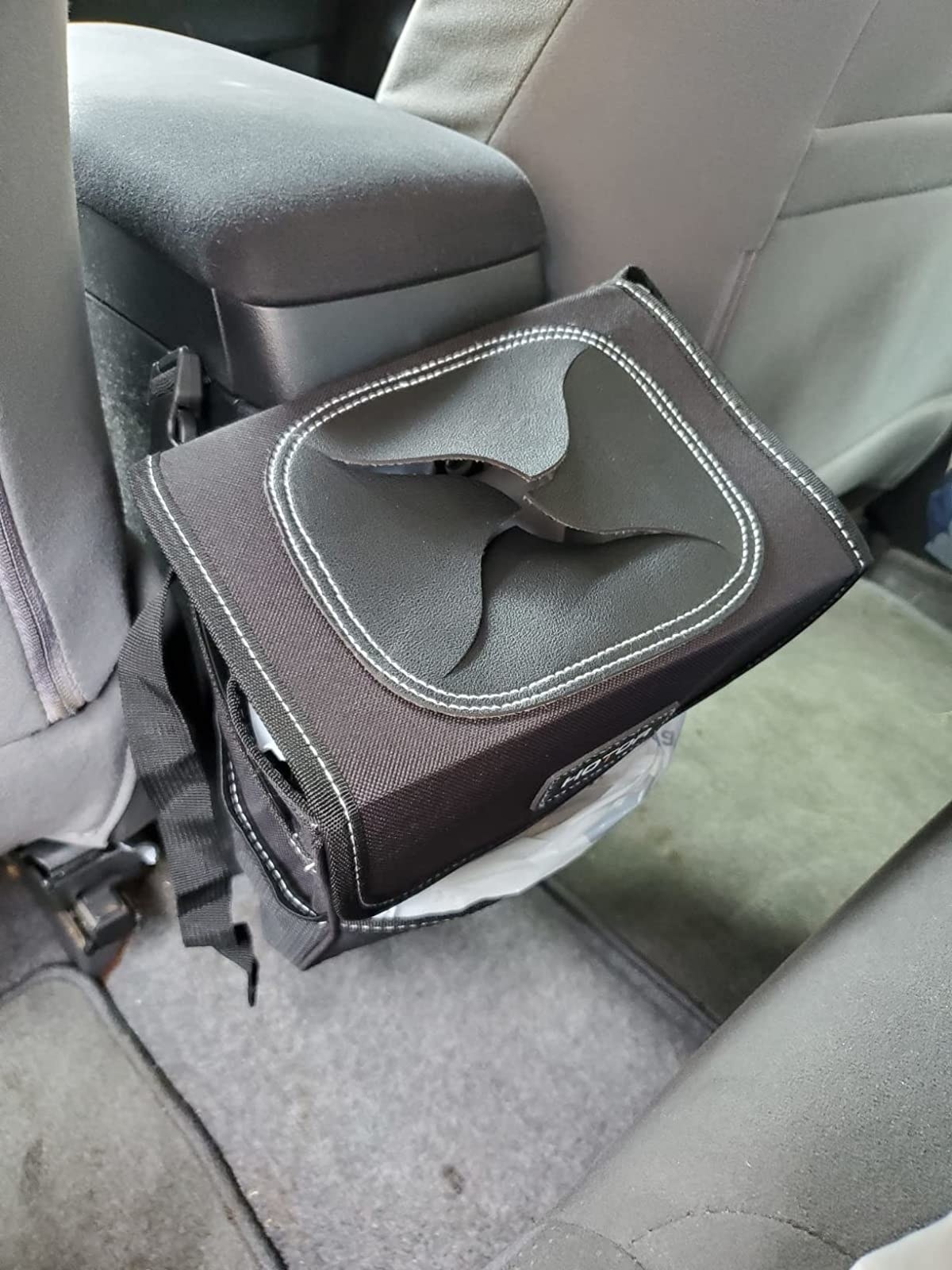 Reviewer image of travel trash can in their car