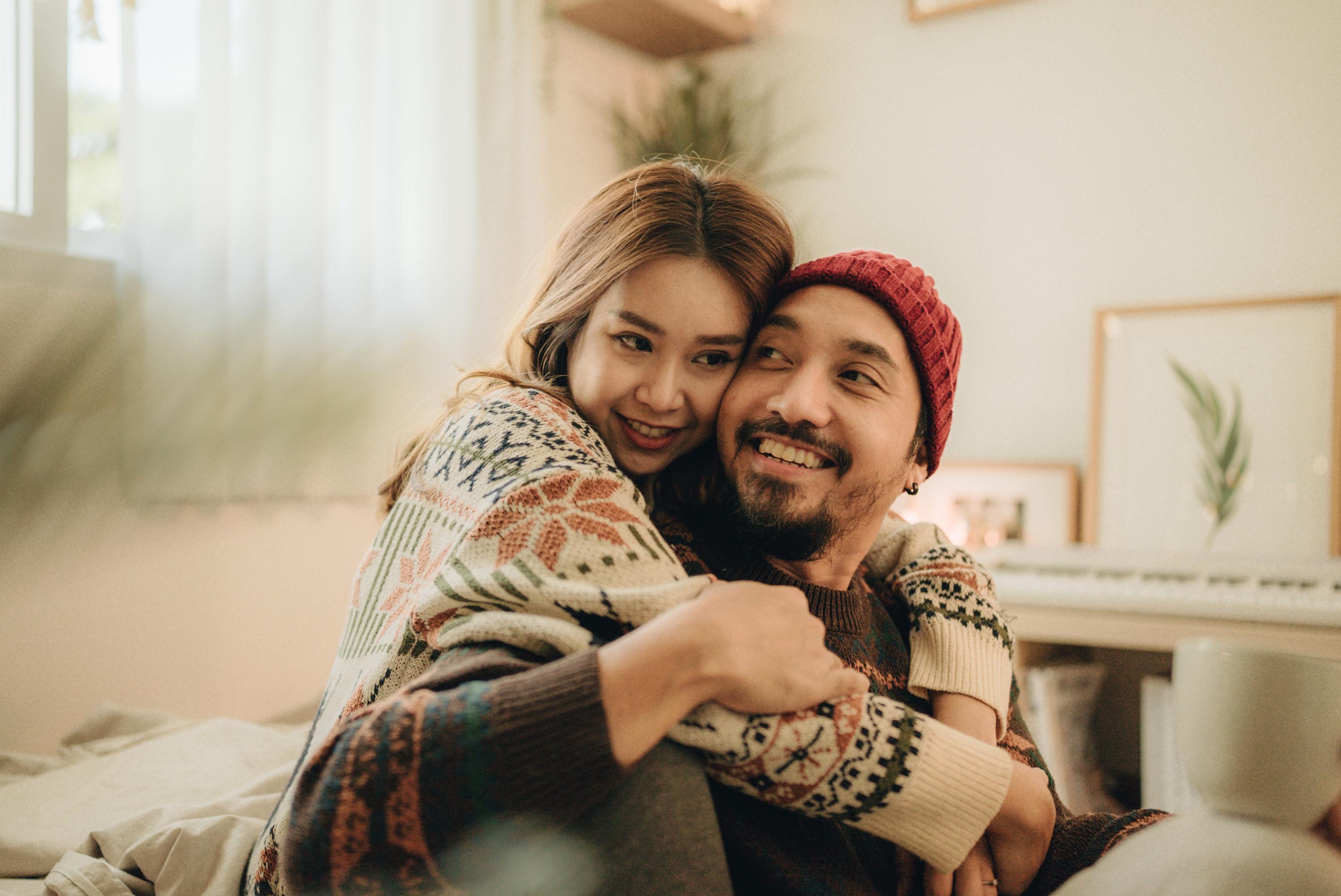 a woman hugging a man from behind