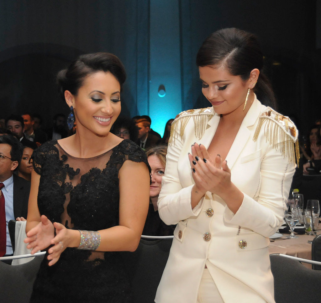 the two clapping at an event