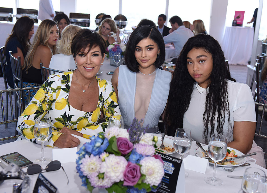 the two sitting at a table with kris jenner
