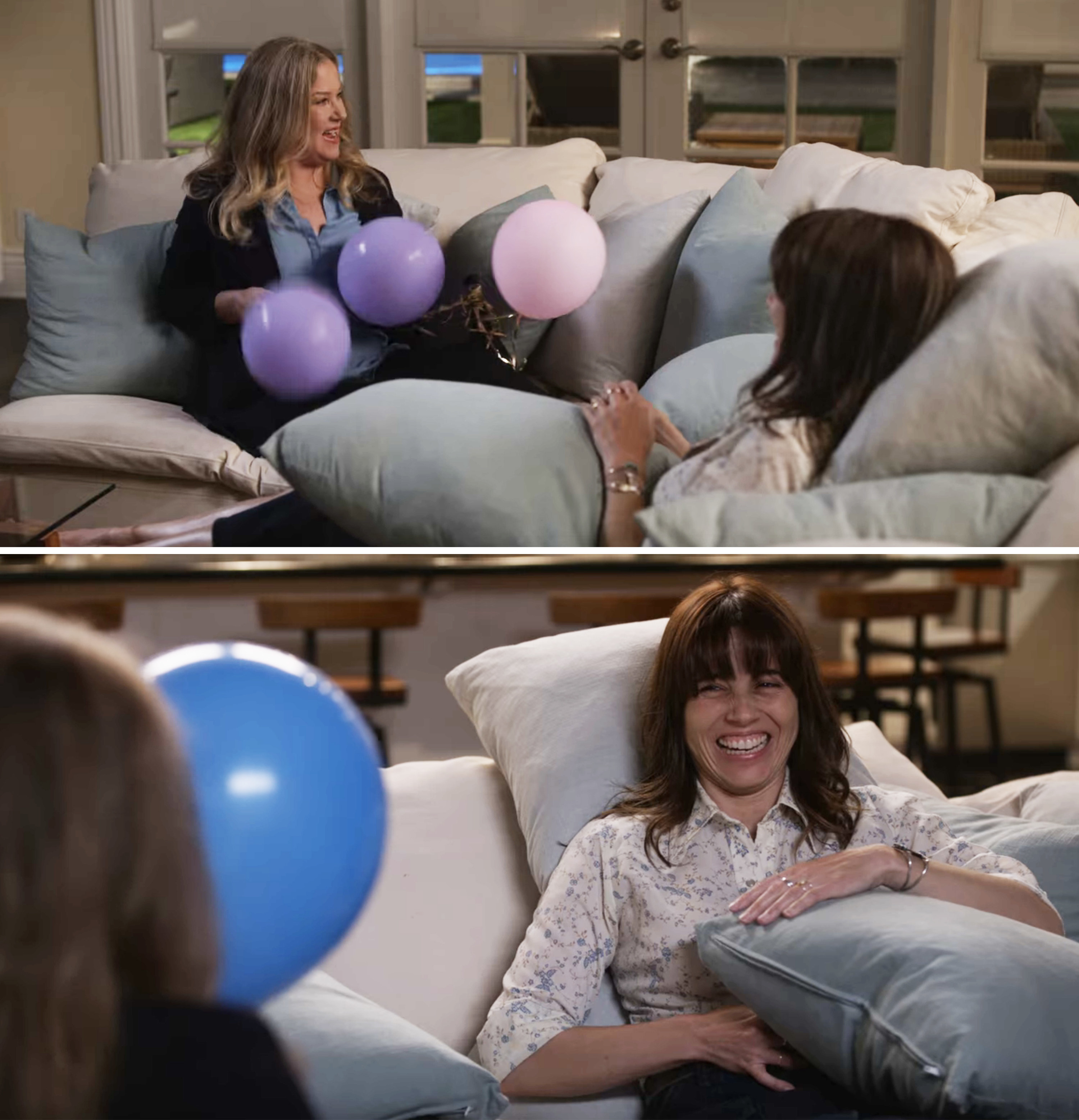 Jen and Judy with balloons on a couch and laughing