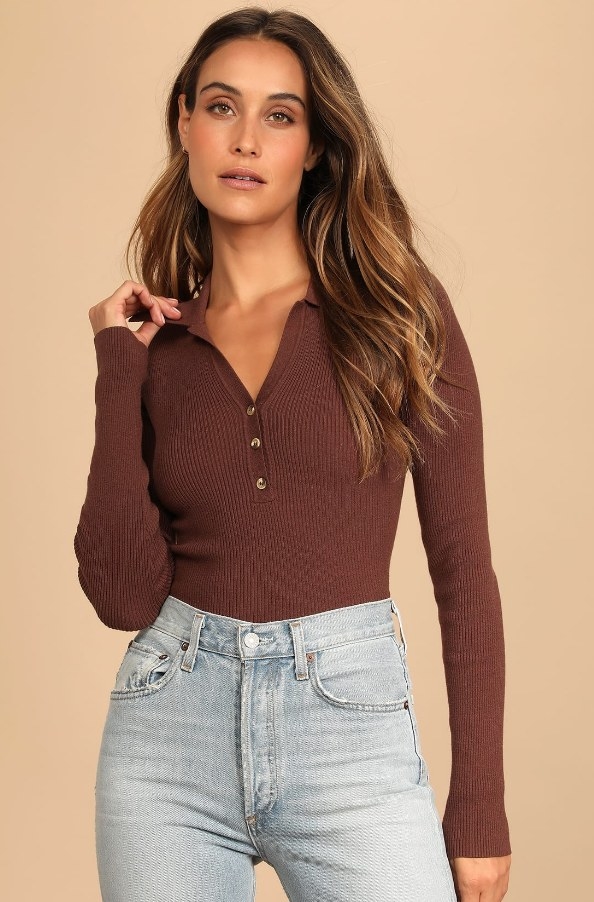 A model wearing a brown, ribbed sweater
