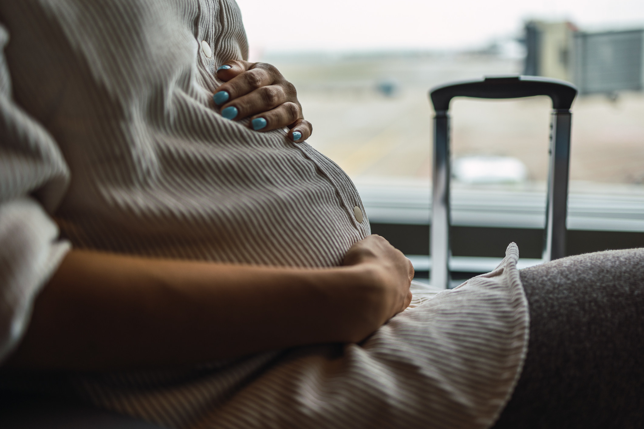 Pregnant woman at the airport