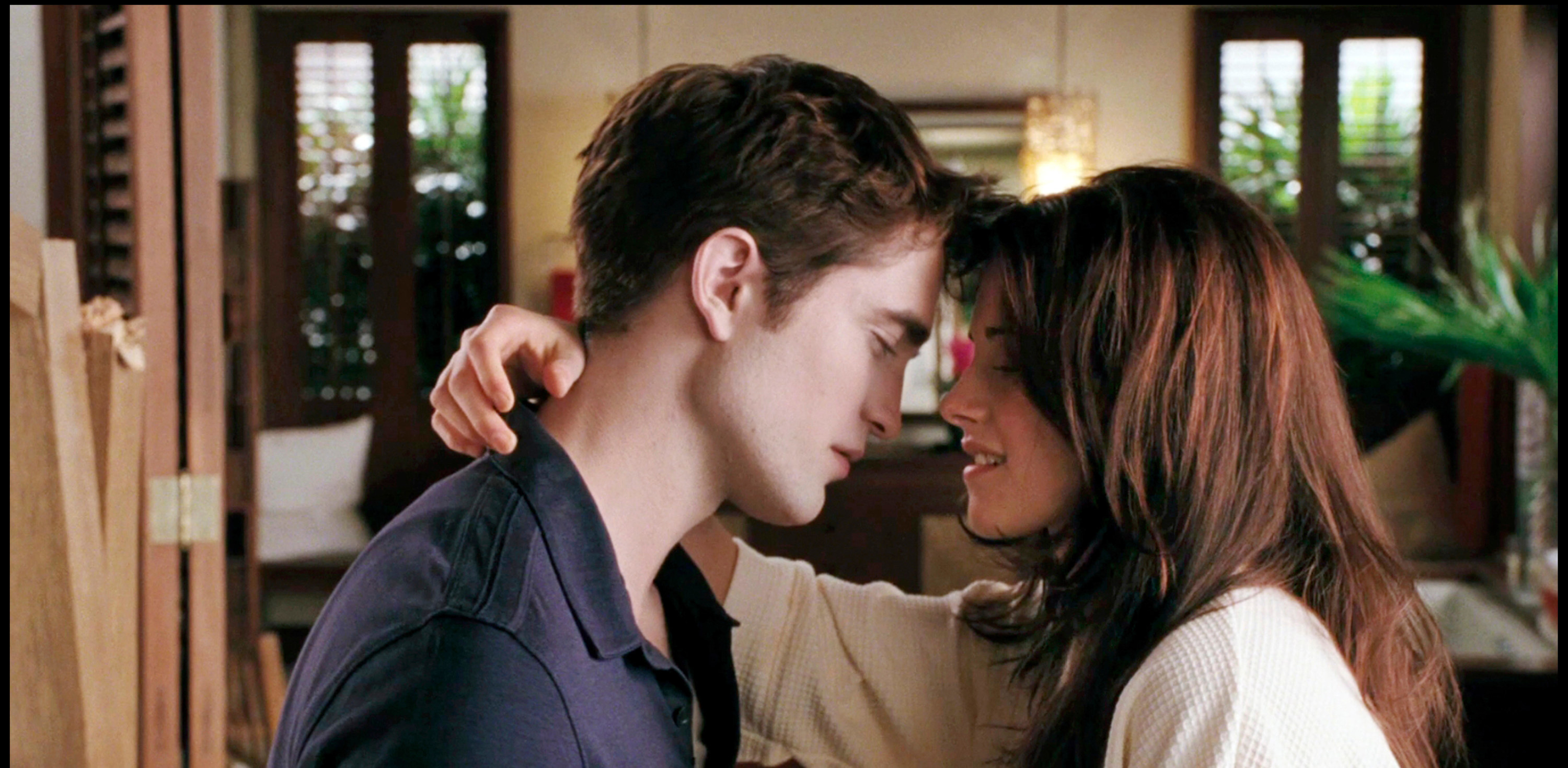 Robert Pattinson and Kristen Stewart embracing in Isle Esme in Twilight.
