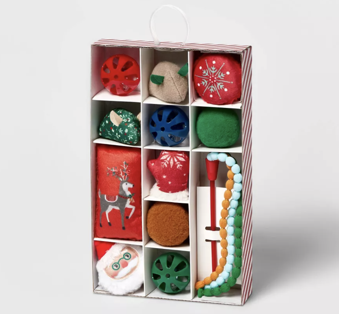 A box containing 12 small holiday themed cat toys