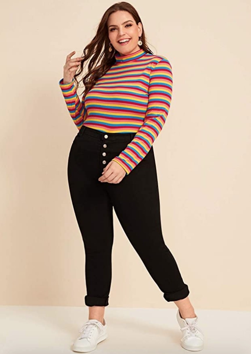A model wearing a colorful striped mock neck