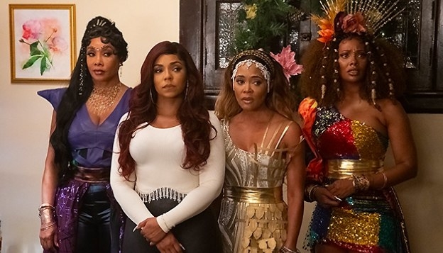 Ashanti stands surrounded by the Christmas spirits in a still from A New Diva&#x27;s Christmas Carol