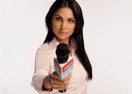 Lara Dutta holding out a mic