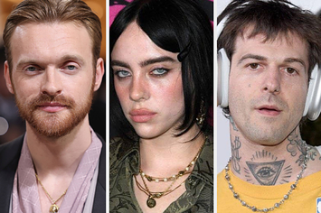 Finneas wears a black suit with a lavender shirt and a gold necklace. Billie Eilish wears a green jacket with black flowers and layered gold necklaces. Jesse Rutherford wears a yellow shirt with a beaded necklace and silver headphones.