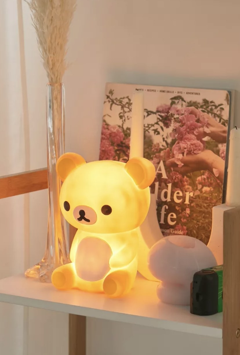The sitting bear has a soft yellowish glow