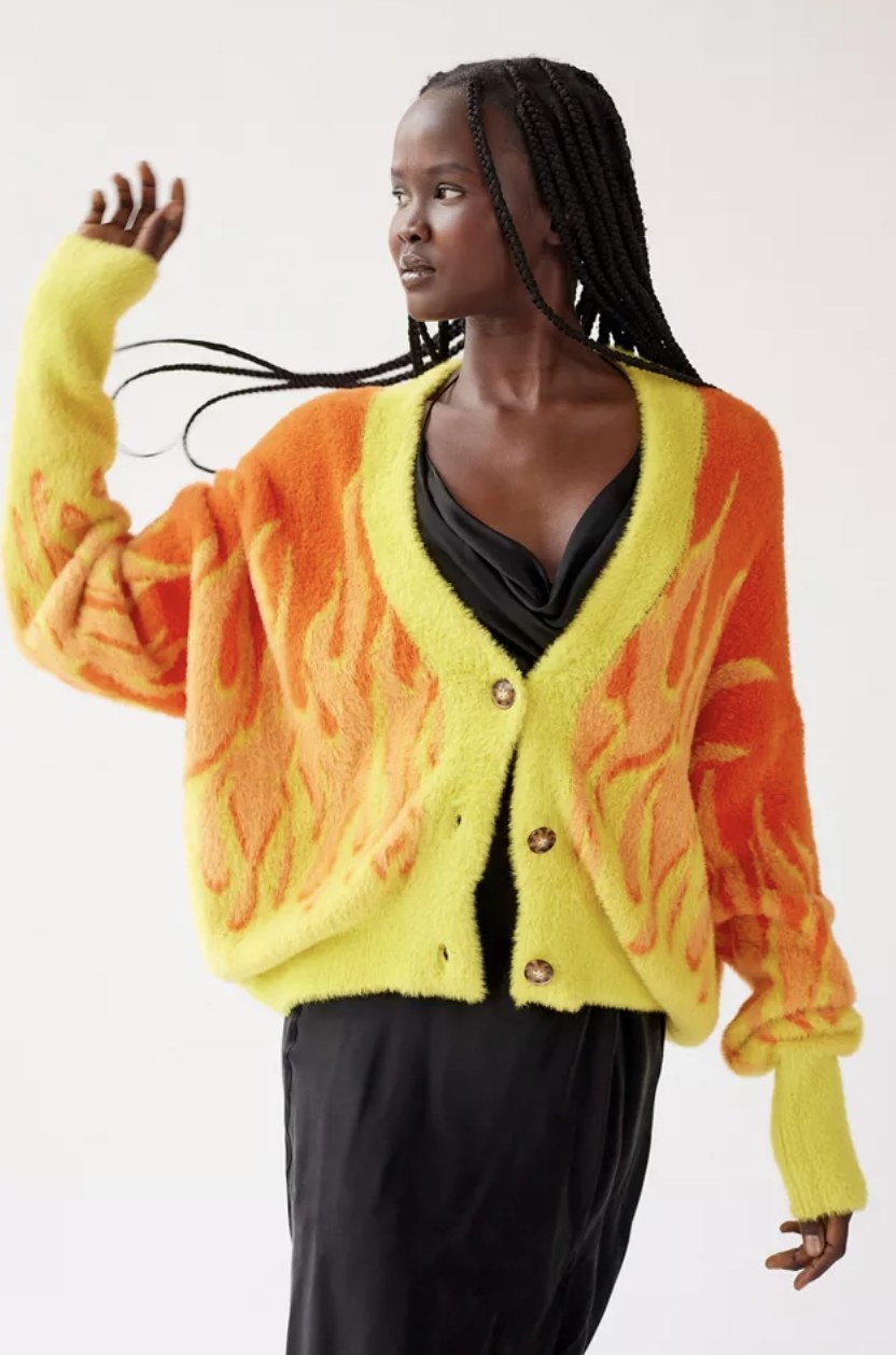 The model rocks the orange and bright yellow flame option